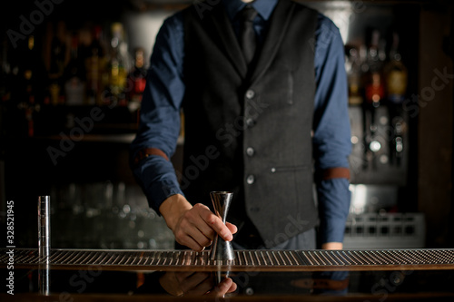 Man bartender getting ready to make cocktails.