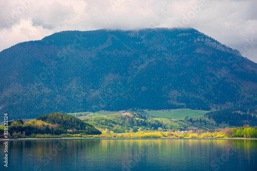 lake in mountains. cloudy day in springtime