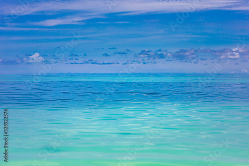 Relaxing seascape with wide horizon of the sky and the sea, soft blue colors