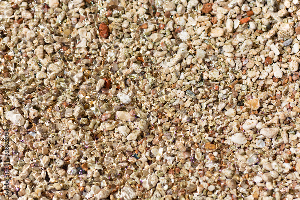 small sea stones on the beach close-up small sea stones on the beach close-up