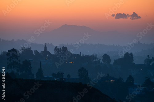 Los Angeles hills at sunrise, famous California city LA silhouette © dell
