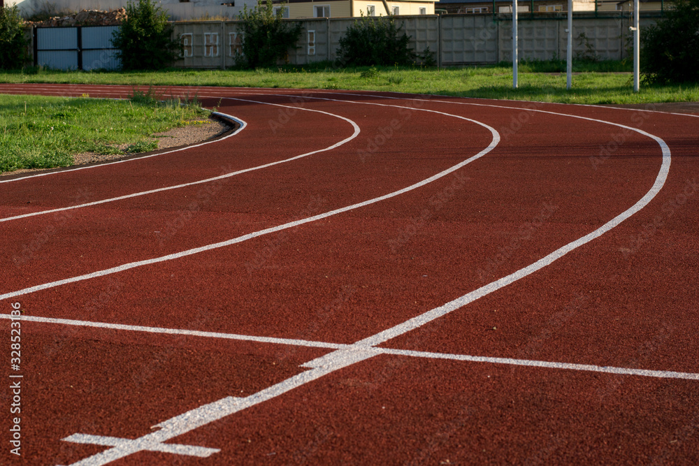 Running track in the stadium. Rubber coating. Treadmill in the fresh air. Healthy lifestyle concept. Athletes cardio workout