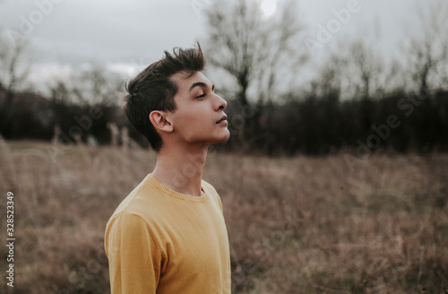 Latino teenager posing in the nature, stylish