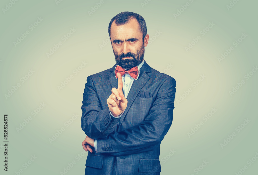 unhappy, serious man gesturing a no sign