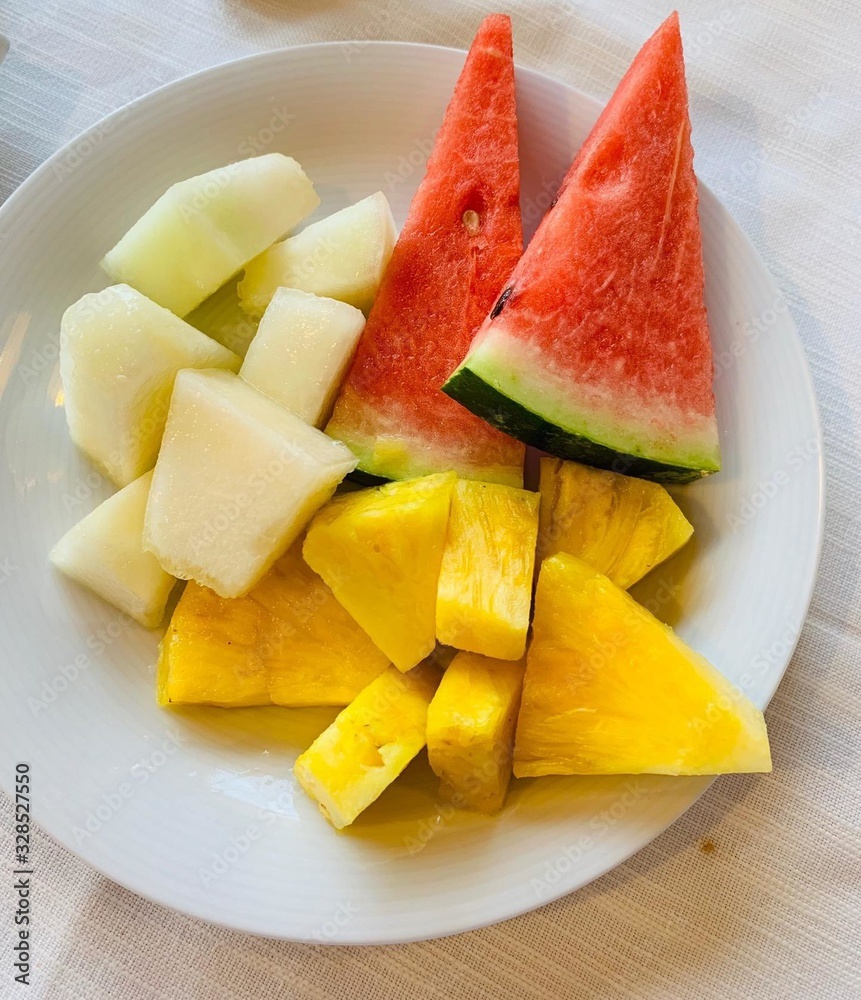 on the table in a plate are pieces of fruit on the table in a plate are pieces of fruit