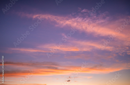 Beautiful gold cloudy twilight sky after sunset, before sunrise © Chanawin