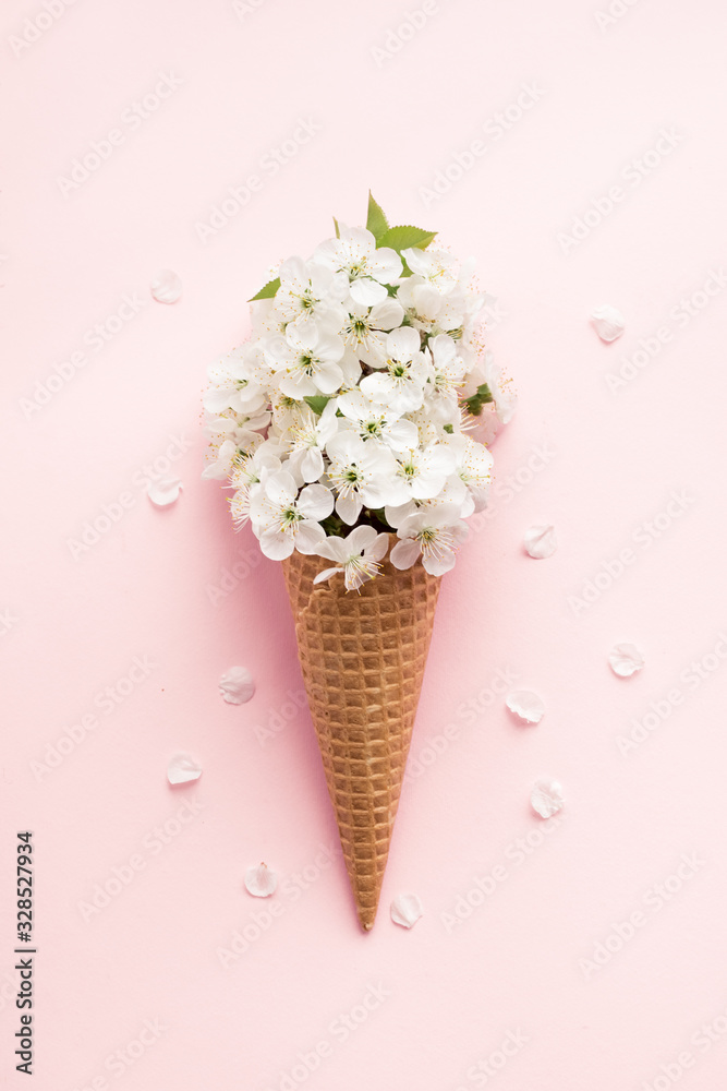 Fototapeta Ice cream cone with white cherry blossom