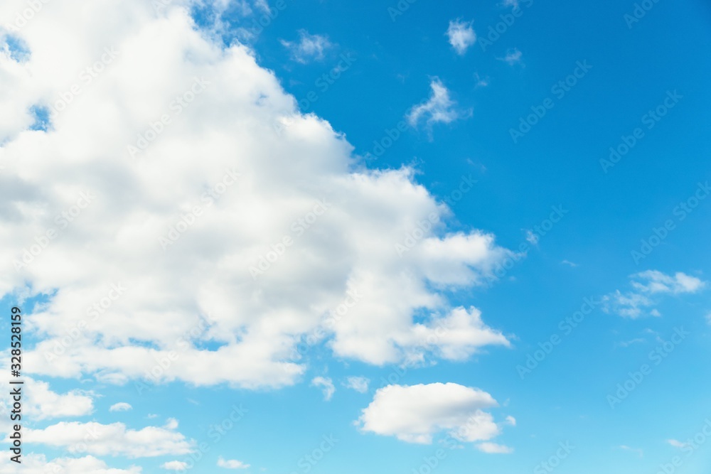 Fototapeta premium Blue sky background. Blue sky with fluffy white clouds. Copy space