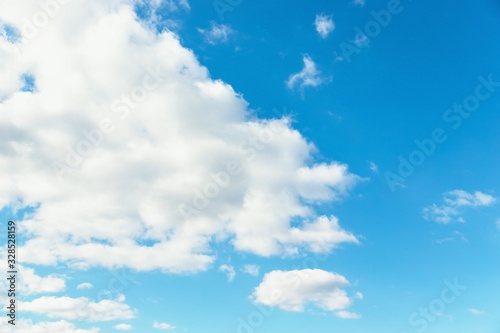 Blue sky background. Blue sky with fluffy white clouds. Copy space