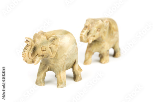 Carved marble elephant on a white background © OttoPles