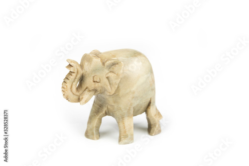 Carved marble elephant on a white background