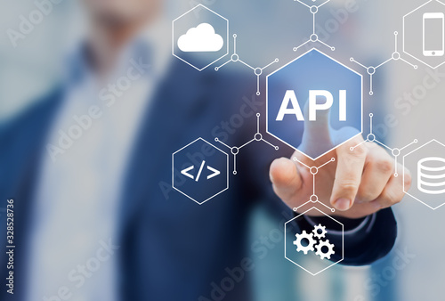 API Application Programming Interface connect services on internet and allow network data communication, software engineer touching concept for IoT, cloud computing, robotic process automation photo