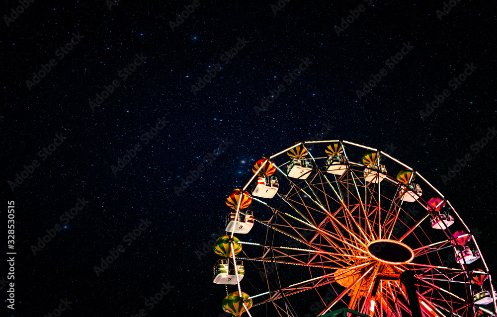 Ferris wheel on a background of the starry night sky