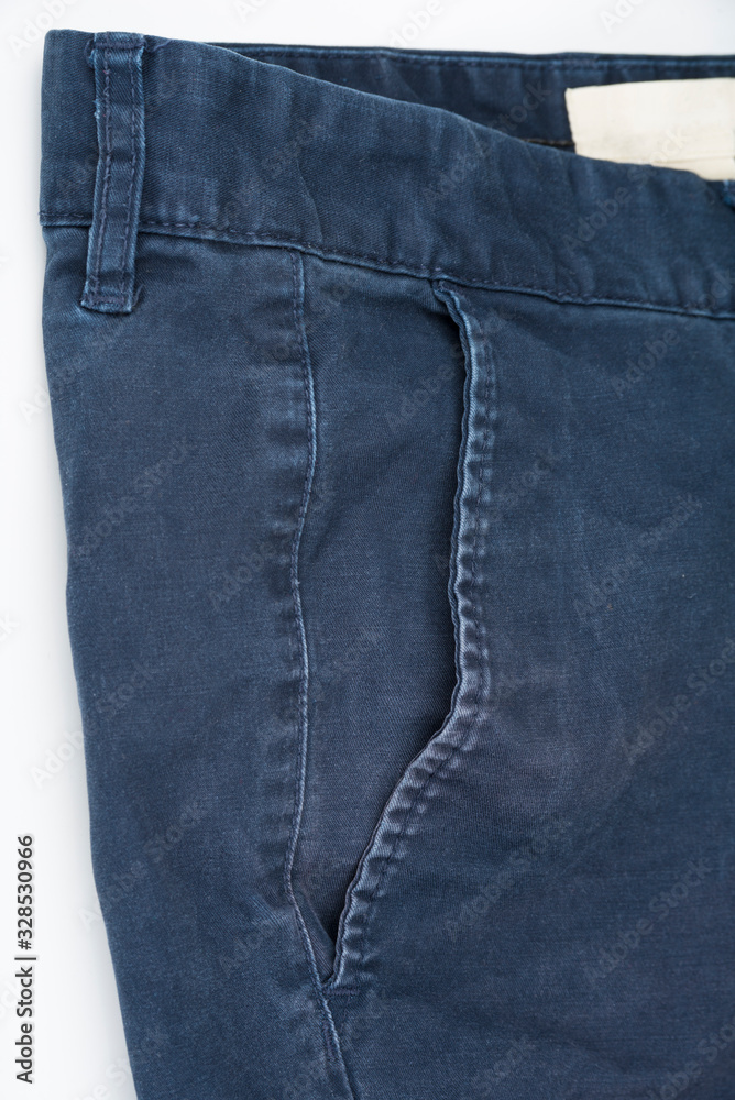 Closeup of male indigo pants on a white Closeup of male indigo pants on a white