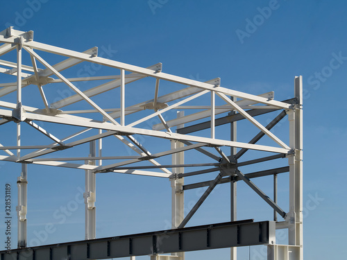 Background with metal structures fire protection coating over clear deep blue sky with copy space