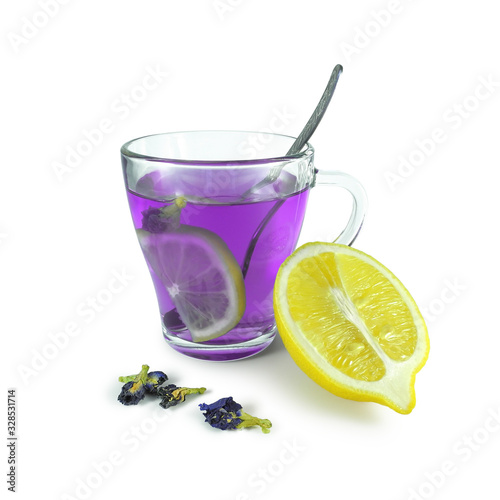 Bright Butterfly pea flower tea (Thai Blue Tea) with lemon, dying it in purple color, next to dried buds and citrus half, isolated on white background 