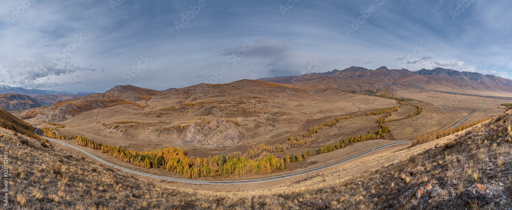 Beautiful road among autumn mountains