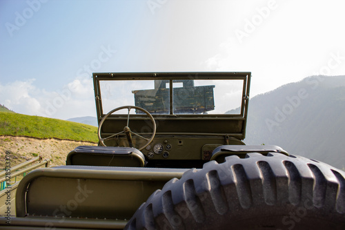 old military vehicle in the mountainss photo