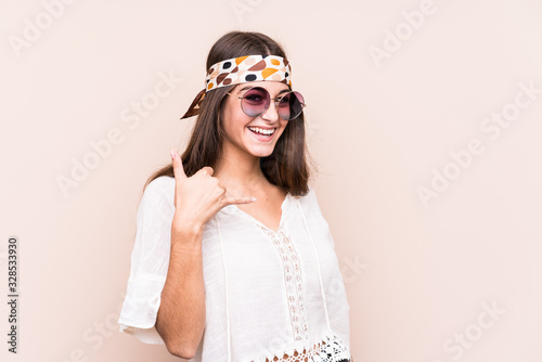 Young hipter caucasian woman isolated showing a mobile phone call gesture with fingers.