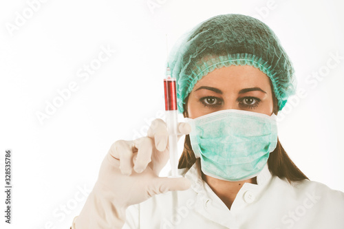 Woman doctor wearing a medical protective mask against coronavirus
