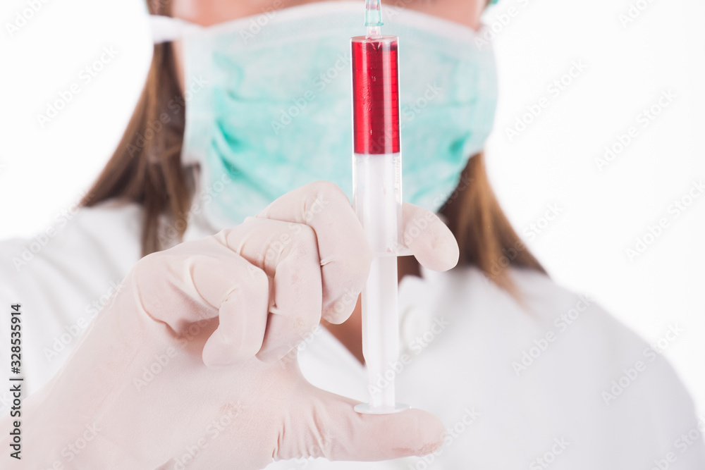 Woman doctor wearing a medical protective mask against coronavirus Woman doctor wearing a medical protective mask against coronavirus