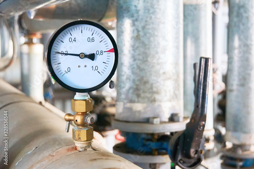 Pressure gauge showing pressure on the water supply pipe.
