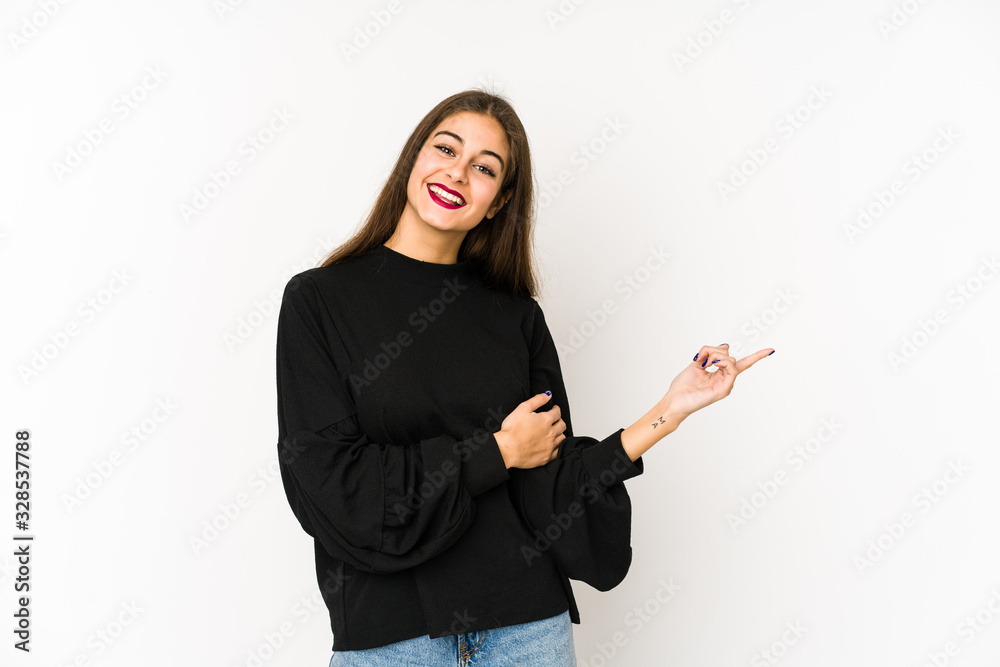 Young caucasian woman isolated on white background smiling cheerfully pointing with forefinger away. Young caucasian woman isolated on white background smiling cheerfully pointing with forefinger away.