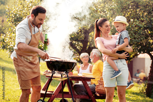 Family makes barbecue together.