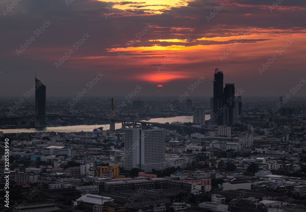 Naklejka premium Beautiful view of Bangkok city, Beauty skyscrapers along Chaopraya river in the evening, making the city modern style.