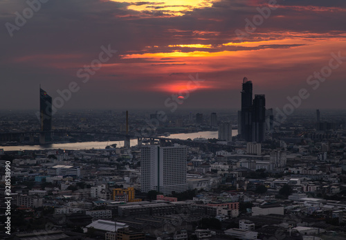 Beautiful view of Bangkok city, Beauty skyscrapers along Chaopraya river in the evening, making the city modern style.