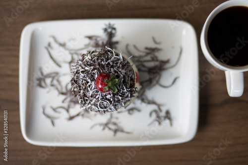 cream cake with coffee and strawberry photo