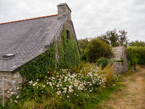 Street view of beautiful Rostudel village. former fishing village, Parc naturel regional d'Armorique. Finistere department, Camaret-sur-Mer. Brittany. photo