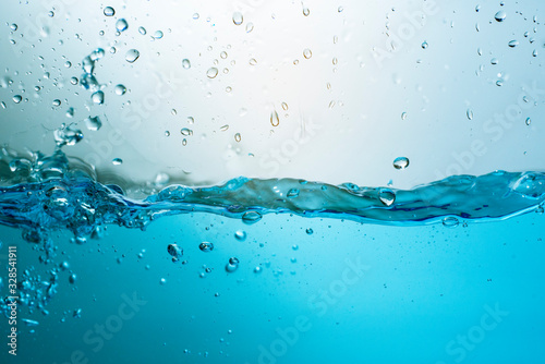 blue sea waves stopped steaming with separate bubbles on a white background. Popular corners, natural concepts