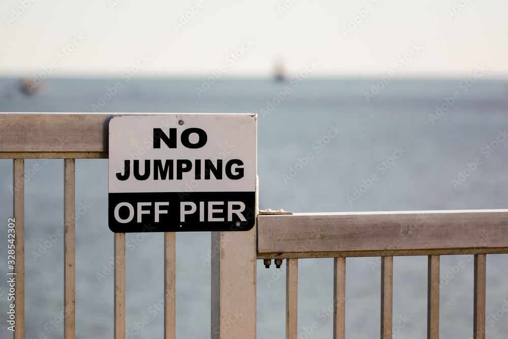 Sign with text No jumping off pier Stock Photo Adobe Stock