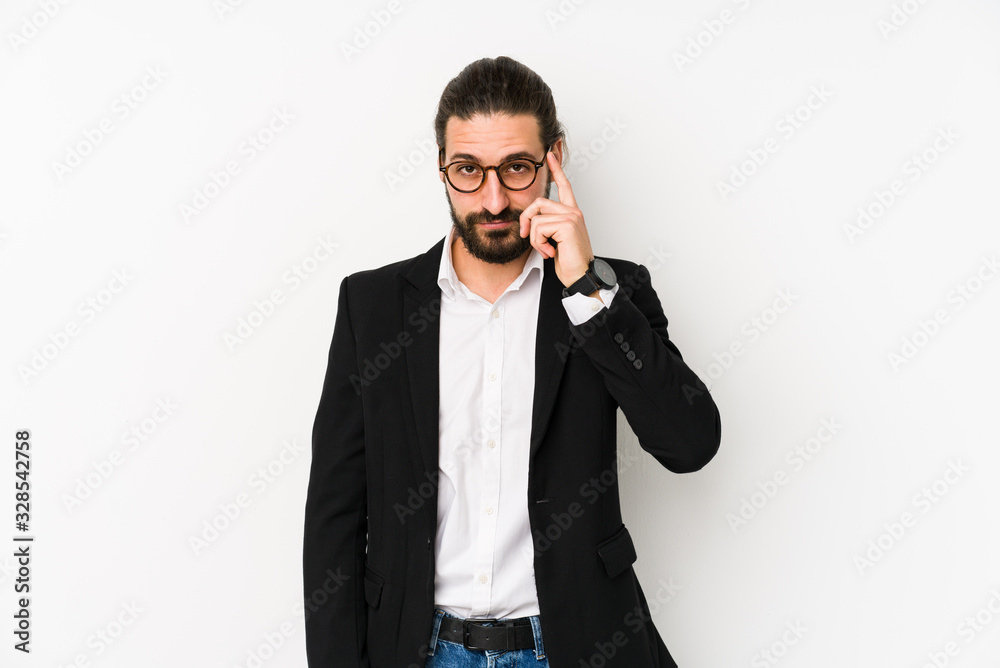 Young caucasian business man isolated on a white background pointing temple with finger, thinking, focused on a task. Young caucasian business man isolated on a white background pointing temple with finger, thinking, focused on a task.