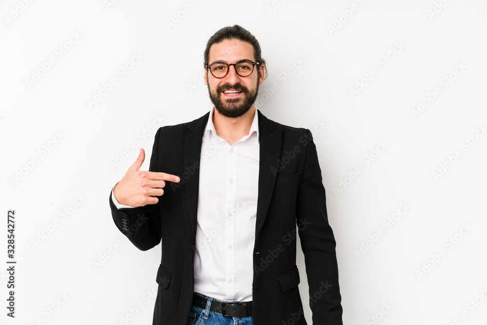 Young caucasian business man isolated on a white background person pointing by hand to a shirt copy space, proud and confident
