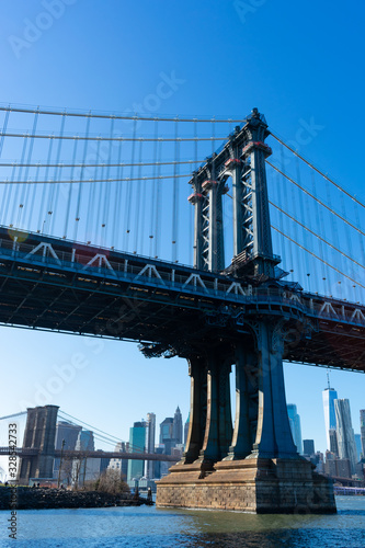 The Manhattan Bridge along the East River with the Lower Manhattan Skyline in New York City © James
