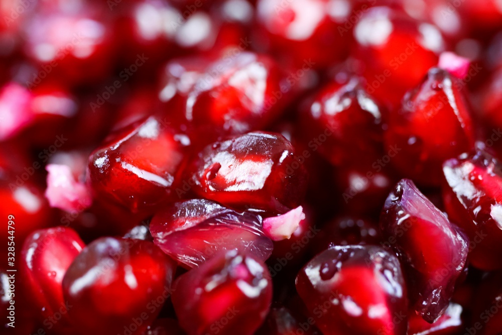 Macro full frame close up of red shiny juicy pomegranate seeds (focus on center) Macro full frame close up of red shiny juicy pomegranate seeds (focus on center)