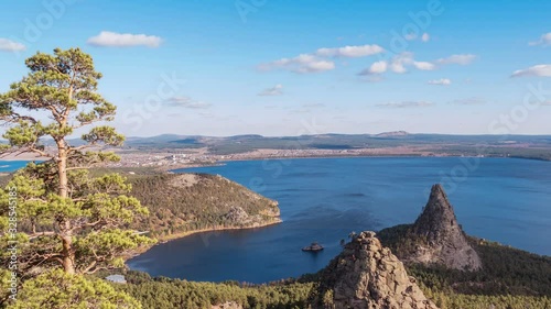 Majestic nature of Kazakhstan concept: epic view of Burabay lake with Okzhetpes and Zhumbaktas rocks from the highest point of Sinyuha Mountain at sunset in autumn season; time lapse photo