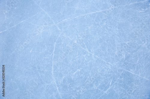 texture of ice skates traces on the blue ice