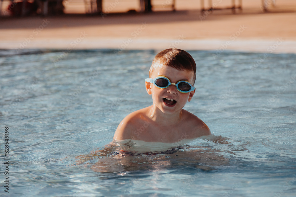 Little boy having fun in the swimming pool