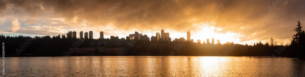 Burnaby, Greater Vancouver, British Columbia, Canada. Beautiful Panoramic View of Deer Lake during a colorful and vibrant winter sunset with Metrotown Buildings in the Background. Panorama