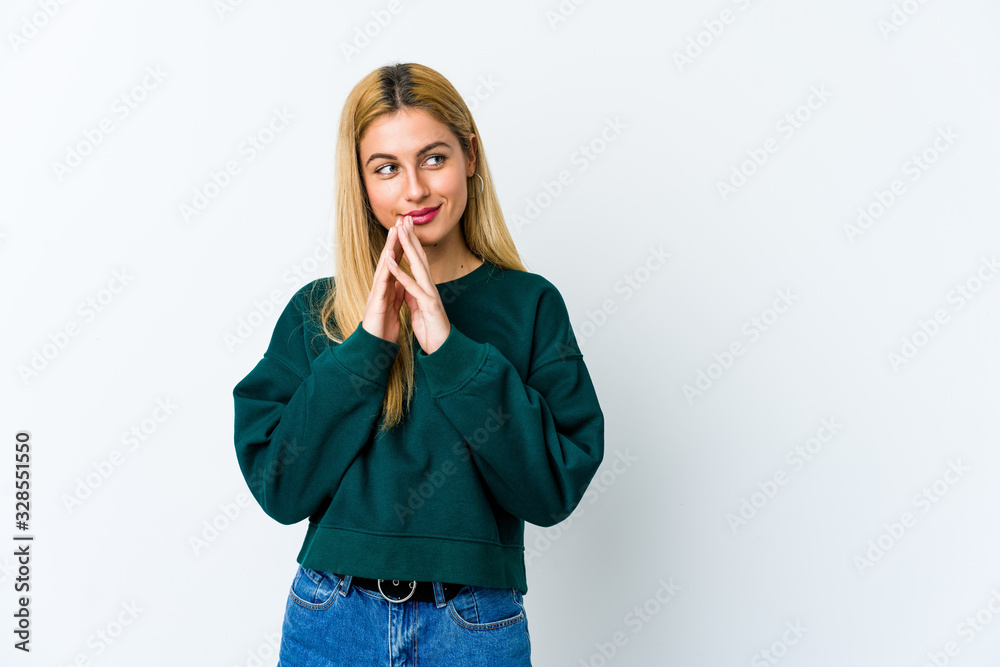 Young blonde woman isolated on white background making up plan in mind, setting up an idea. Young blonde woman isolated on white background making up plan in mind, setting up an idea.