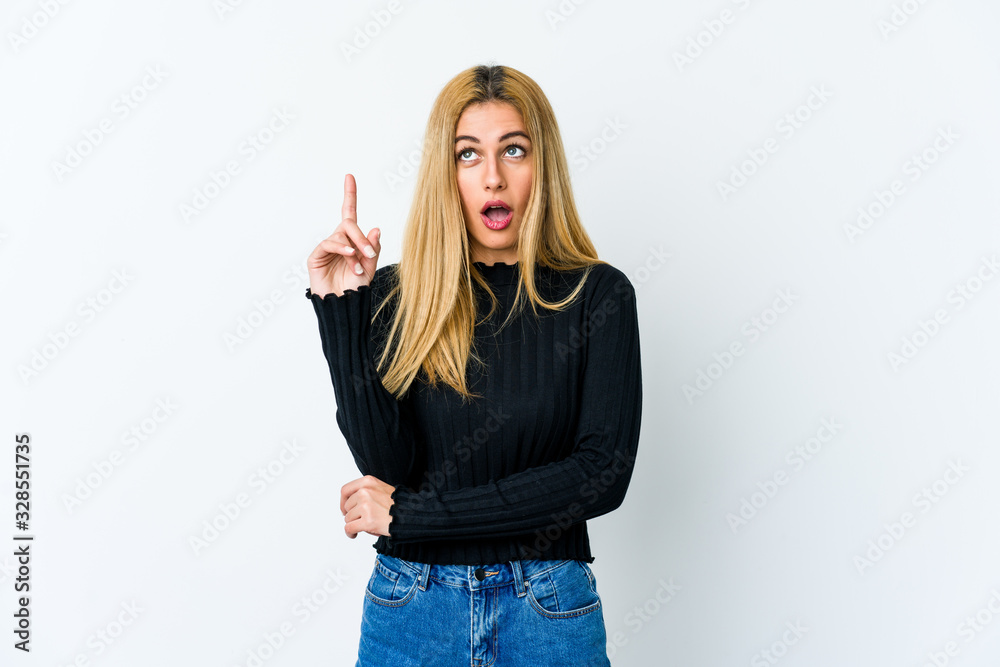 Young blonde woman isolated on white background having some great idea, concept of creativity. Young blonde woman isolated on white background having some great idea, concept of creativity.