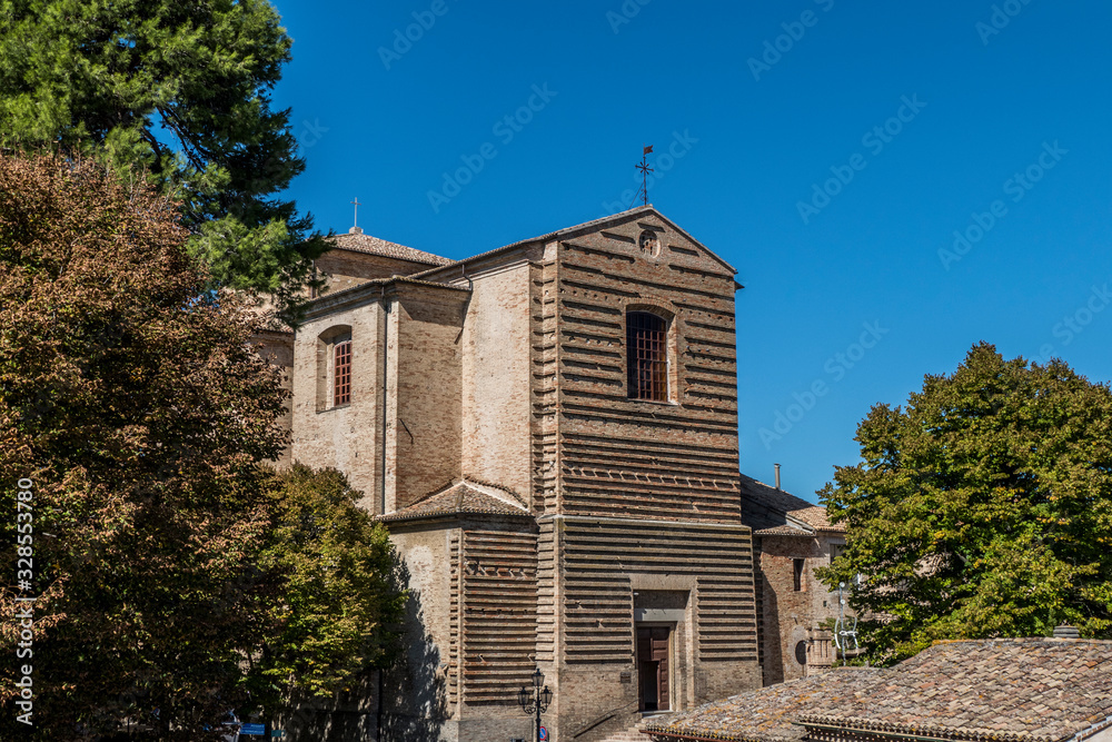 HIstorical center of Corinaldo with stone houses, chucrh, steps and flowers