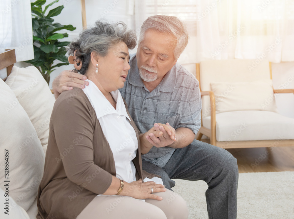 Obraz premium Sick asian senior woman or grandmother is fainted and fallen on floor, grandfather help,care,support of her,elderly people unconscious lying on the ground,concept of dizziness,fainting