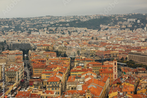 Scenery panoramic city scape view of Nice, France. Traditional red roofs, houses and architecture in Nice. Cote d'Azur France. Luxury resort of French riviera.