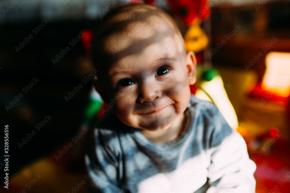 Portrait of a smiling baby with a nice light and shadow Portrait of a smiling baby with a nice light and shadow