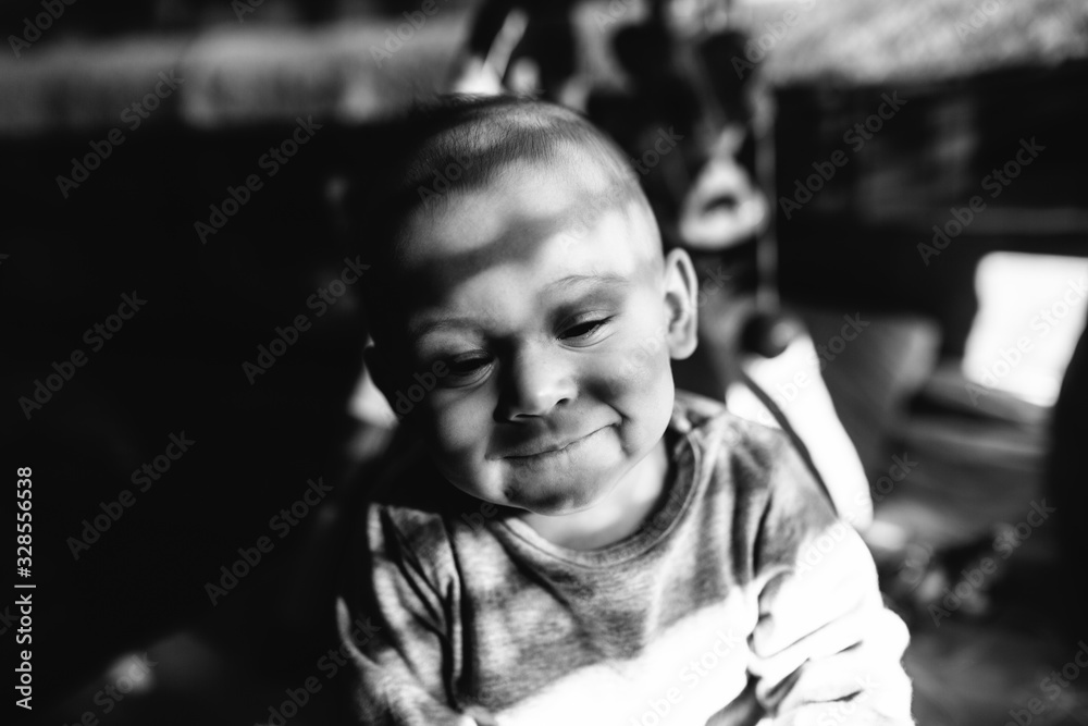 Portrait of a smiling baby with a nice light and shadow Portrait of a smiling baby with a nice light and shadow
