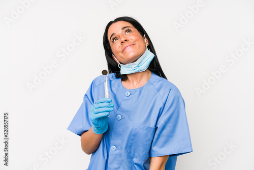 Dentist woman isolated on white background dreaming of achieving goals and purposes